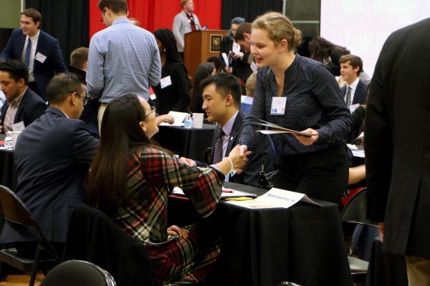 Student networking with professional