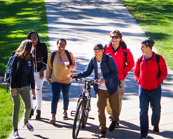 diverse students walking on campus